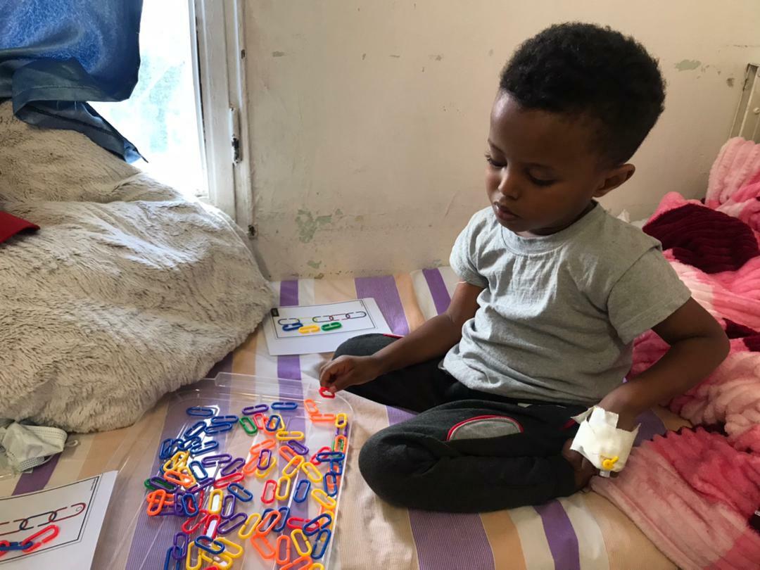 Child with art therapy supplies